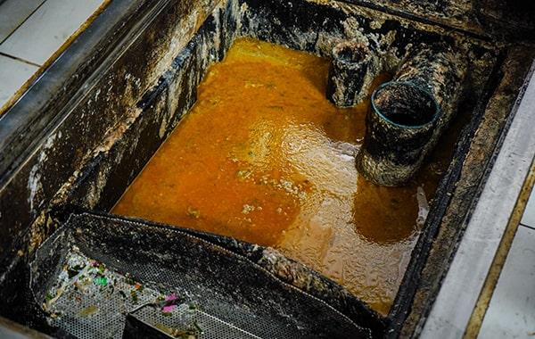 delaying grease trap cleaning can result in foul odors, sanitation concerns, and pricey repairs